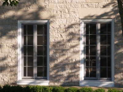 Replacement windows in a limestone building